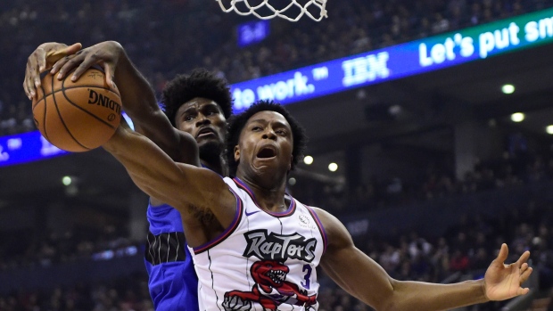 Raptors forward OG Anunoby and Magic forward Jonathan Isaac battle Monday.