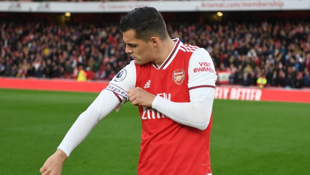 Granit Xhaka removes captain's armband, Stuart MacFarlane/Arsenal FC via Getty Images Granit Xhaka removes captain's armband