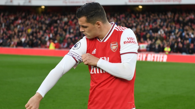 Granit Xhaka removes captain's armband, Stuart MacFarlane/Arsenal FC via Getty Images Granit Xhaka removes captain's armband