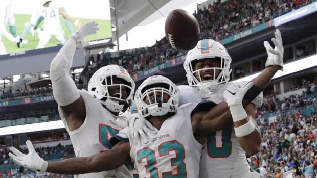 Miami Dolphins celebrate, The Canadian Press Miami Dolphins celebrate