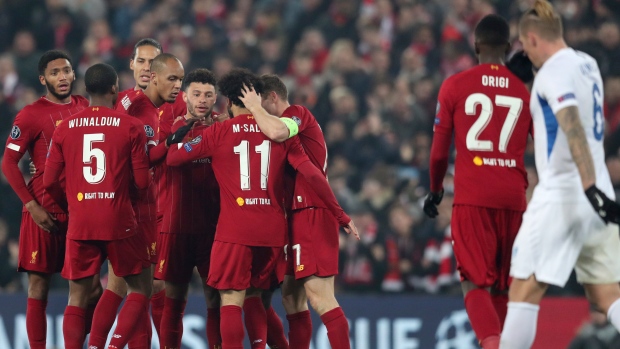 Liverpool players celebrate, The Canadian Press Liverpool players celebrate