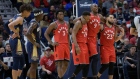 Serge Ibaka (9) is helped off the court by his Toronto Raptors teammates