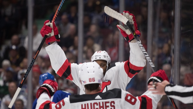 Wayne Simmonds, back, and Jack Hughes (86, The Canadian Press Wayne Simmonds, back, and Jack Hughes (86