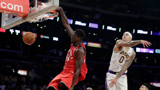 Pascal Siakam, left, dunks past Kyle Kuzma (0), The Canadian Press Pascal Siakam, left, dunks past Kyle Kuzma (0)