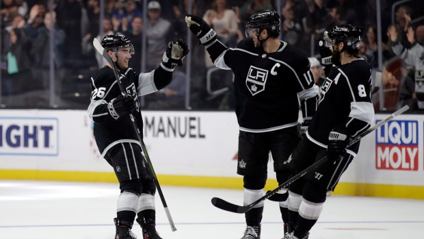 Sean Walker, left, celebrates his goal with Anze Kopitar, center, and Drew Doughty (8), The Canadian Press Sean Walker, left, celebrates his goal with Anze Kopitar, center, and Drew Doughty (8)