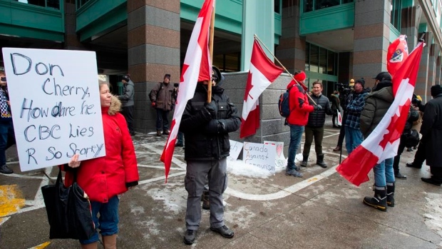Small group of Cherry supporters protest his firing outside Rogers headquarters, The Canadian Press Small group of Cherry supporters protest his firing outside Rogers headquarters