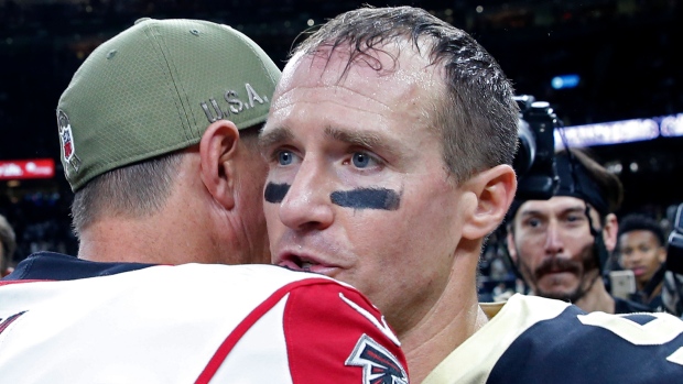 Saints quarterback Drew Brees congratulates Falcons QB Matt Ryan Sunday.