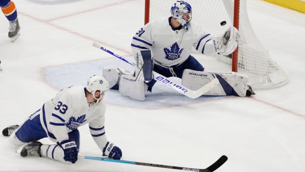 Leafs goalie Frederik Andersen and centre Frederik Gauthier watch as the puck enters the net.