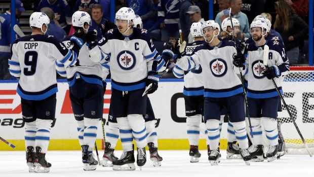 The Winnipeg Jets celebrate, The Canadian Press The Winnipeg Jets celebrate
