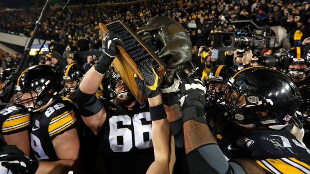 Iowa carries off the Floyd of Rosedale Trophy 