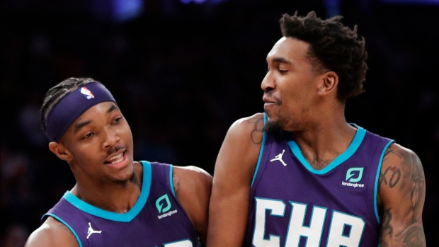 Devonte' Graham and Malik Monk , The Canadian Press Devonte' Graham and Malik Monk