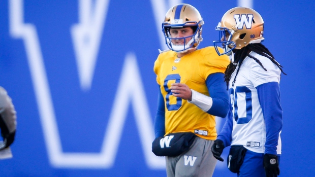 Zach Collaros and Janarion Grant, The Canadian Press Zach Collaros and Janarion Grant