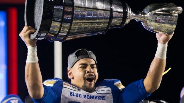 Andrew Harris hoists Grey Cup, The Canadian Press Andrew Harris hoists Grey Cup