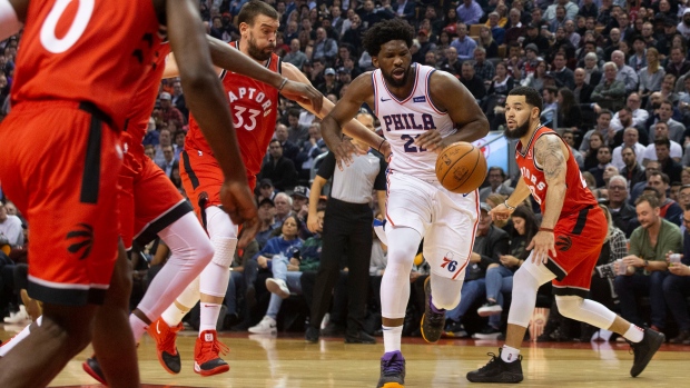 Philadelphia's Joel Embiid tries to drive against the Raptors Monday in Toronto.