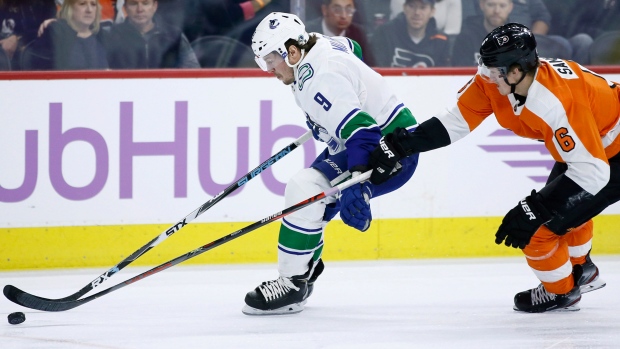 Vancouver's J.T. Miller tries to elude Philadelphia's Travis Sanheim on Monday, The Canadian Press Vancouver's J.T. Miller tries to elude Philadelphia's Travis Sanheim on Monday