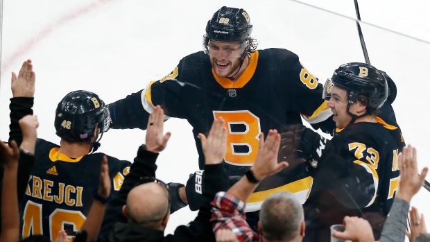 Bruins beat Penguins in overtime for sixth straight win