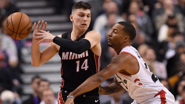 Raptors guard Norman Powell defends against Miami's Tyler Herro.