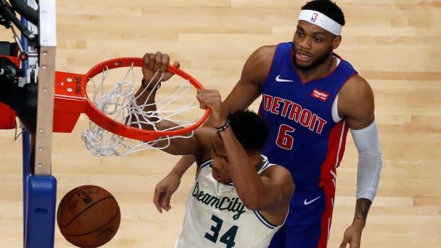 Giannis Antetokounmpo (34) dunks as Bruce Brown (6) watches , The Canadian Press Giannis Antetokounmpo (34) dunks as Bruce Brown (6) watches