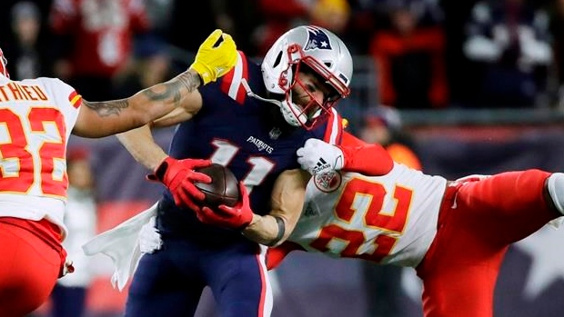 Julian Edelman is tackled by Kansas City Chiefs defenders, The Canadian Press Julian Edelman is tackled by Kansas City Chiefs defenders