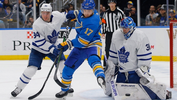 Leafs defenceman Tyson Barrie and goalie Frederik Andersen battle Blues' Jaden Schwartz.