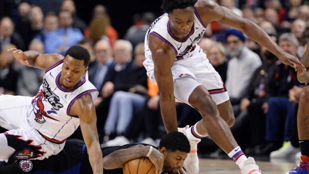 Raptors' Kyle Lowry, left, and OG Anunoby battle Clippers forward Paul George., The Canadian Press Raptors' Kyle Lowry, left, and OG Anunoby battle Clippers forward Paul George.