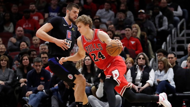 Lauri Markkanen, right, Ivica Zubac