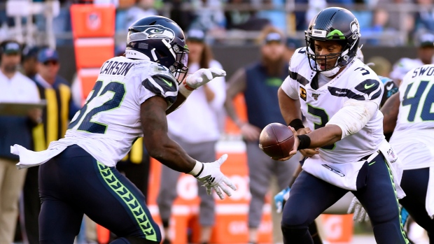 Chris Carson, Russell WIlson, The Canadian Press Chris Carson, Russell WIlson