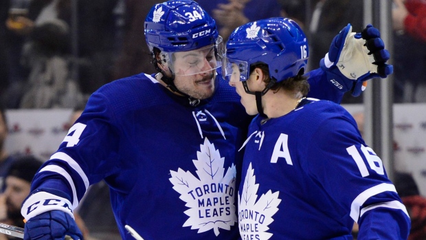 Auston Matthews and Mitch Marner celebrate a goal.