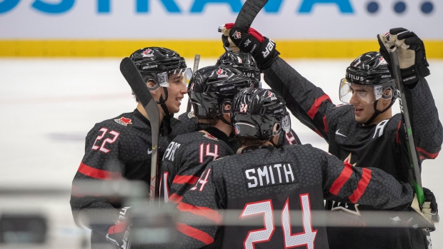 Team Canada celebrates , The Canadian Press Team Canada celebrates