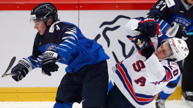 Finland's Ville Heinola hits American Parker Ford in Thursday's quarter-final., The Canadian Press Finland's Ville Heinola hits American Parker Ford in Thursday's quarter-final.