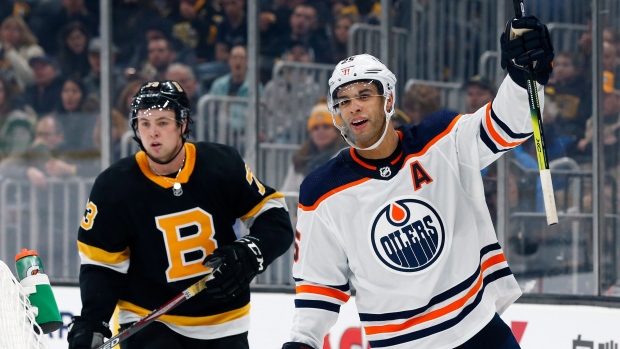 Darnell Nurse (25) celebrates his goal in front of Charlie McAvoy, The Canadian Press Darnell Nurse (25) celebrates his goal in front of Charlie McAvoy