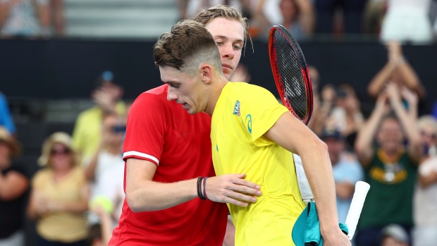 Alex de Minaur of Australia, right, is congratulated by Denis Shapovalov