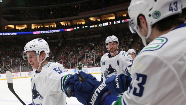 Vancouver Canucks celebrate, The Canadian Press Vancouver Canucks celebrate