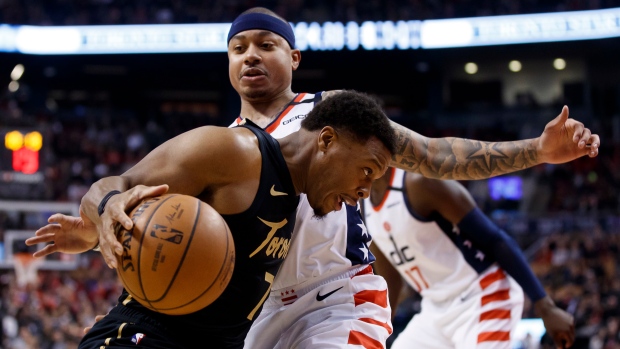 Kyle Lowry drives to the net against Wizards guard Isaiah Thomas Friday.