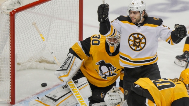 Jake DeBrusk celebrates in front of Matt Murray 