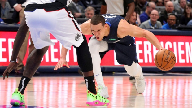 Dwight Powell injures Achilles, The Canadian Press Dwight Powell injures Achilles