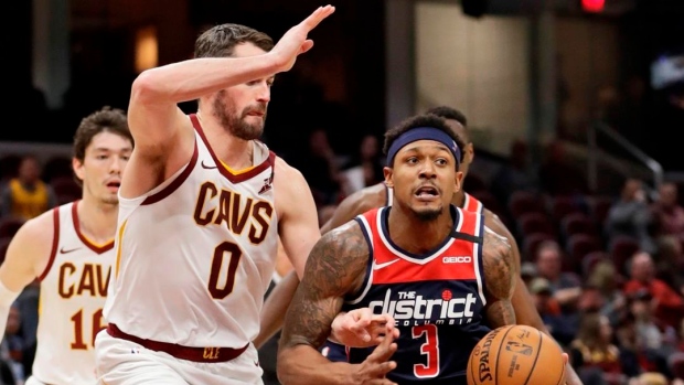Washington Wizards' Bradley Beal (3) drives past Cleveland Cavaliers' Kevin Love (0)