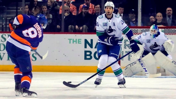 Hughes, Schaller lead Canucks past Islanders 4-3 Article Image 0, The Canadian Press Hughes, Schaller lead Canucks past Islanders 4-3 Article Image 0
