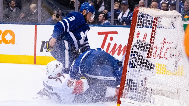 Frank Vatrano crashes into Frederik Andersen