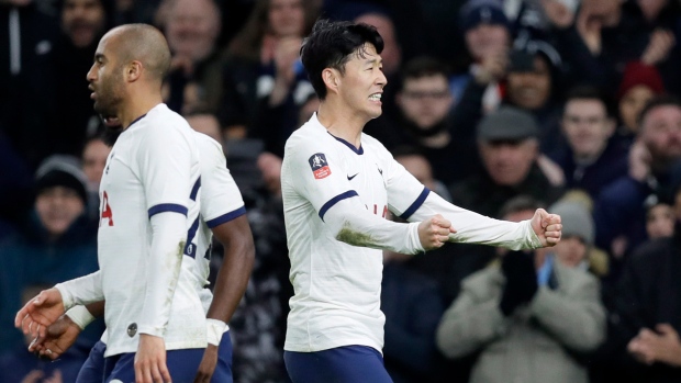 Son Heung-min, right, celebrates