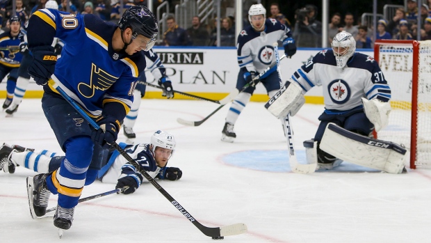 Connor Hellebuyck, Nikolaj Ehlers and Brayden Schenn