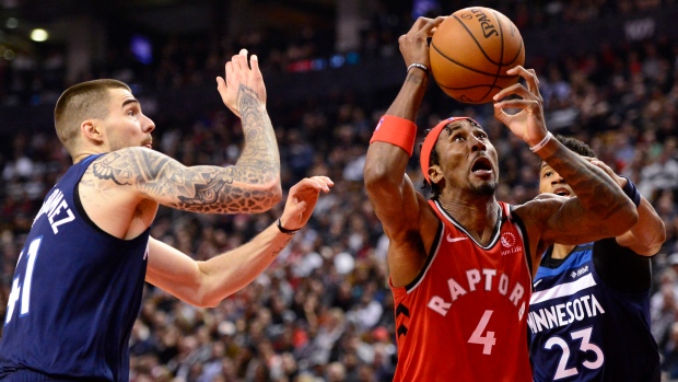 Raptors forward Rondae Hollis-Jefferson grabs a rebound Monday night against Minnesota.