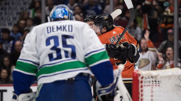 Ducks celebrate goal vs. Demko, The Canadian Press Ducks celebrate goal vs. Demko