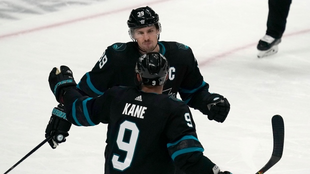 Logan Couture (39) celebrates with Evander Kane (9), The Canadian Press Logan Couture (39) celebrates with Evander Kane (9)