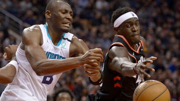 Hornets centre Bismack Biyombo and Raptors forward Pascal Siakam battle for the ball Friday., The Canadian Press Hornets centre Bismack Biyombo and Raptors forward Pascal Siakam battle for the ball Friday.