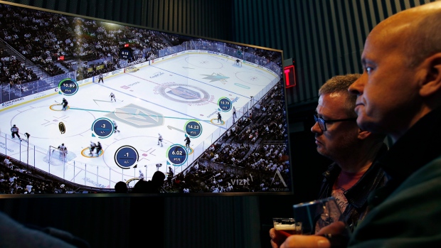 People watch real-time puck and player tracking technology , The Canadian Press People watch real-time puck and player tracking technology