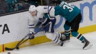 Leafs winger Zach Hyman battles Sharks defenceman Mario Ferraro on Tuesday.