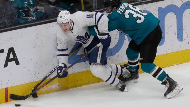 Leafs winger Zach Hyman battles Sharks defenceman Mario Ferraro on Tuesday.