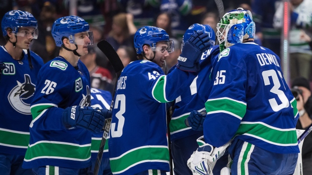 Vancouver Canucks celebrate , The Canadian Press Vancouver Canucks celebrate