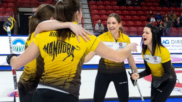 Team Kerri Einarson celebrate their Scotties victory 